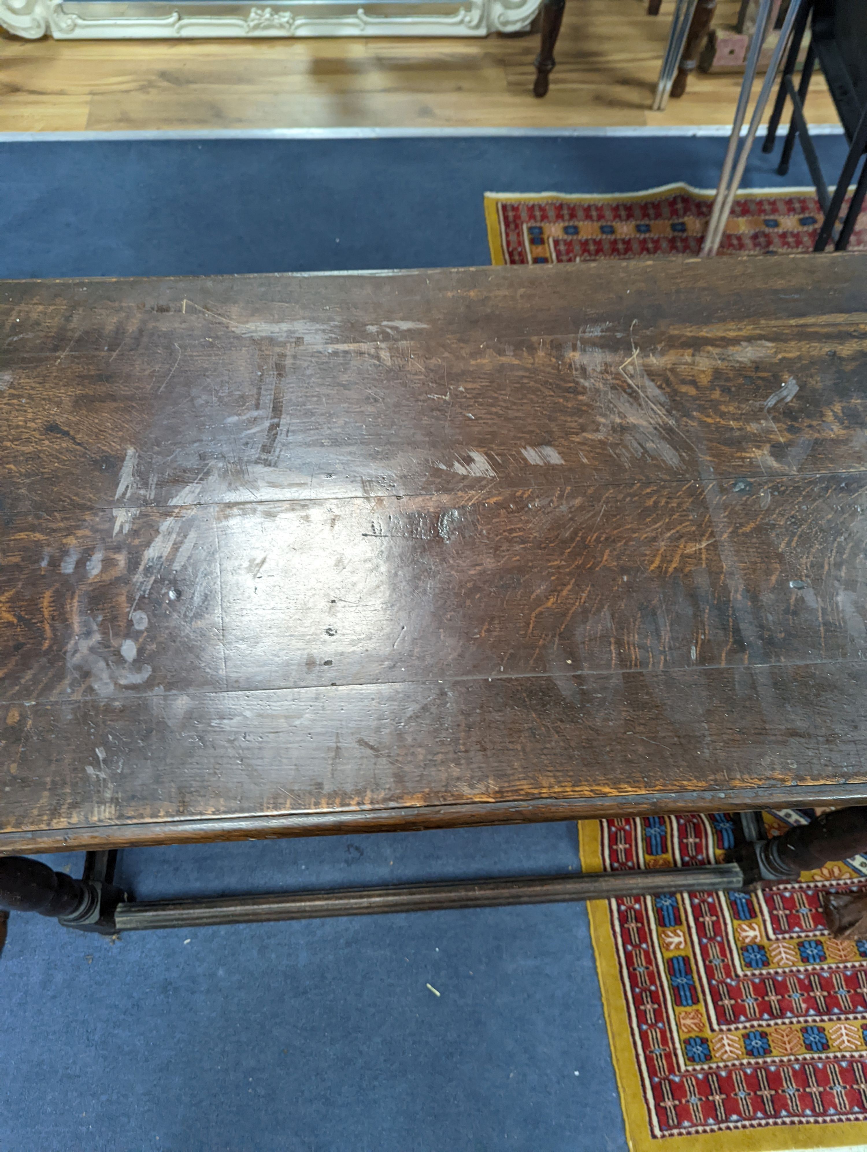 An 18th century rectangular oak table, width 112cm, depth 54cm, height 76cm